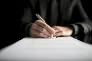 SGP Credit - Personal Loan With Low Interest Rate | Closeup of lawyer or executive signing a contract