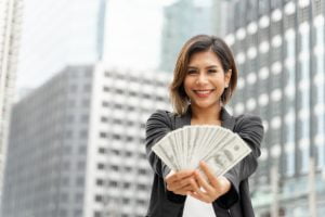 SGP Credit - Personal Loan With Low Interest Rate | successful-beautiful-asian-business-woman-holding-money-us-dollar-bills-hand-business-concept