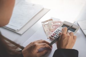 SGP Credit - Personal Loan With Low Interest Rate | finance and accounting concept. business woman working on desk