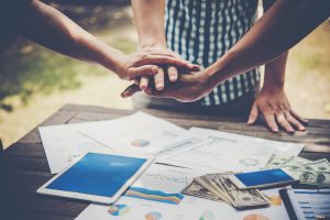 SGP Credit - Personal Loan With Low Interest Rate | Business people making pile of hands Teamwork concept