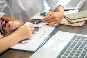 SGP Credit - Personal Loan With Low Interest Rate | teamwork process business people discussing the charts and grap