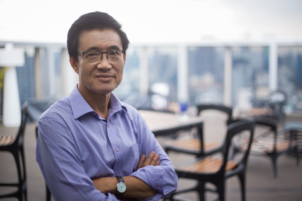 Smiling Senior Man in Cafe